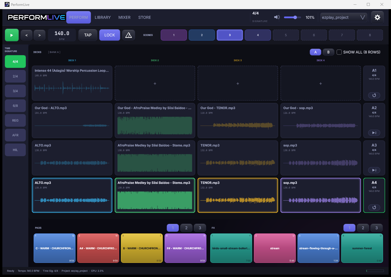 The PerformLive perform workspace: four decks of stems, scenes, transport, and twelve pads